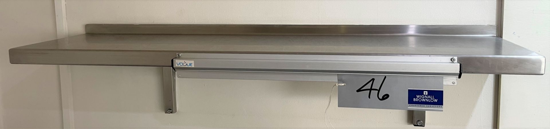 A Wall Mounting Stainless Steel Shelf with Vogue Ticket Holder, 1200mm x 300mm.