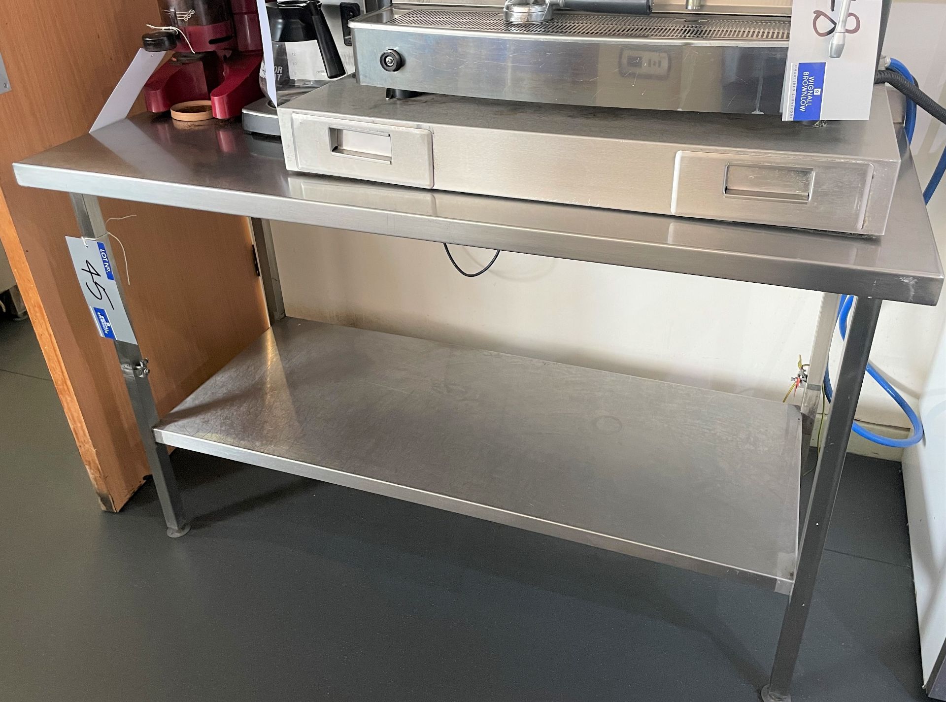 A Stainless Steel Bench with undershelf, 1400mm x 650mm x 870mm h.