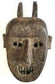 Vintage African Wood Tribal Mask. Measures 12 inches long.