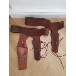 2 Brown Suede Gun Holsters and one leather.