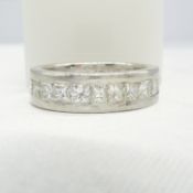 A pre-loved, hand-made platinum eternity ring set with 4.50 carats princess-cut diamonds