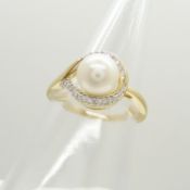 A classically-styled 9ct yellow gold cultured pearl and half-moon diamond ring