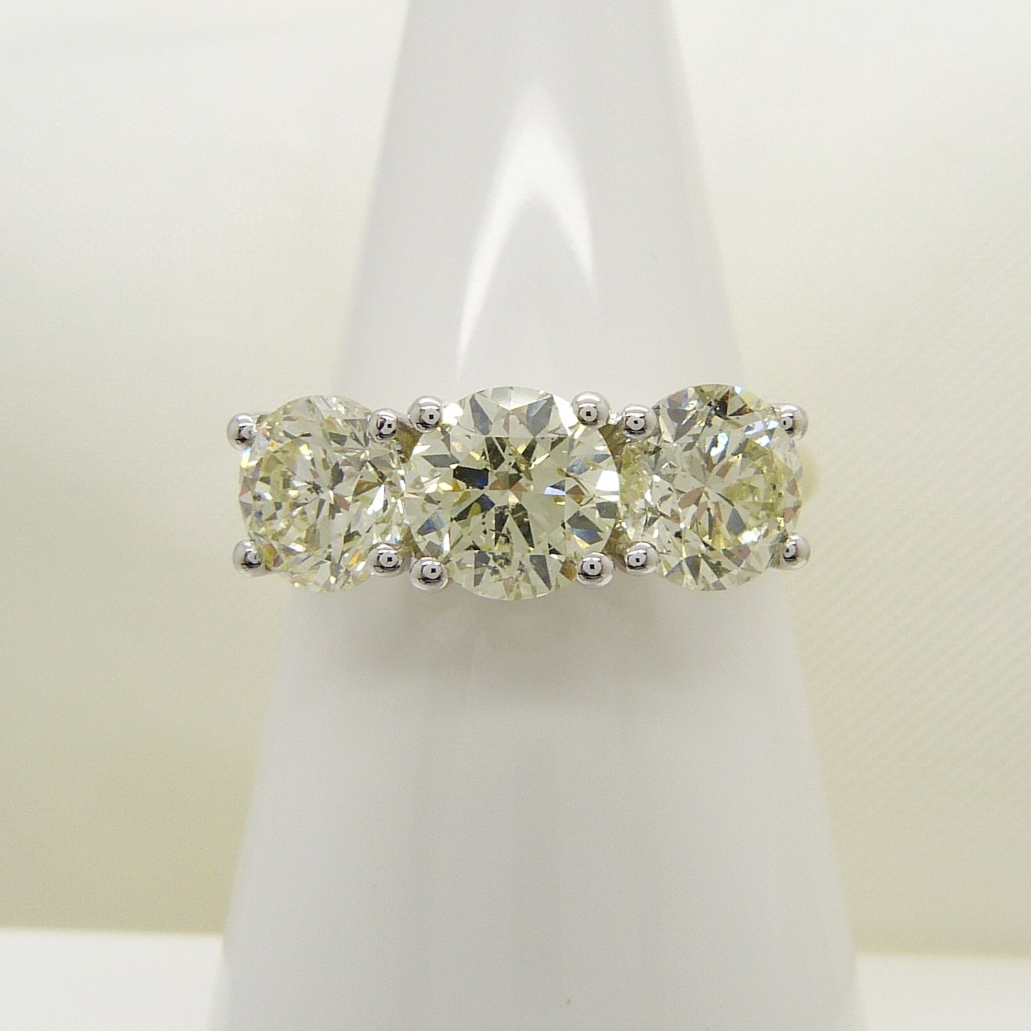 A stunning WGI certificated 3.11 carat diamond 3-stone ring in 18ct yellow and white gold