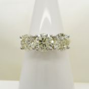 A stunning WGI certificated 3.11 carat diamond 3-stone ring in 18ct yellow and white gold