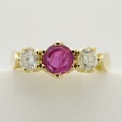 A vintage-style 3-stone ruby and diamond ring in 18ct yellow gold