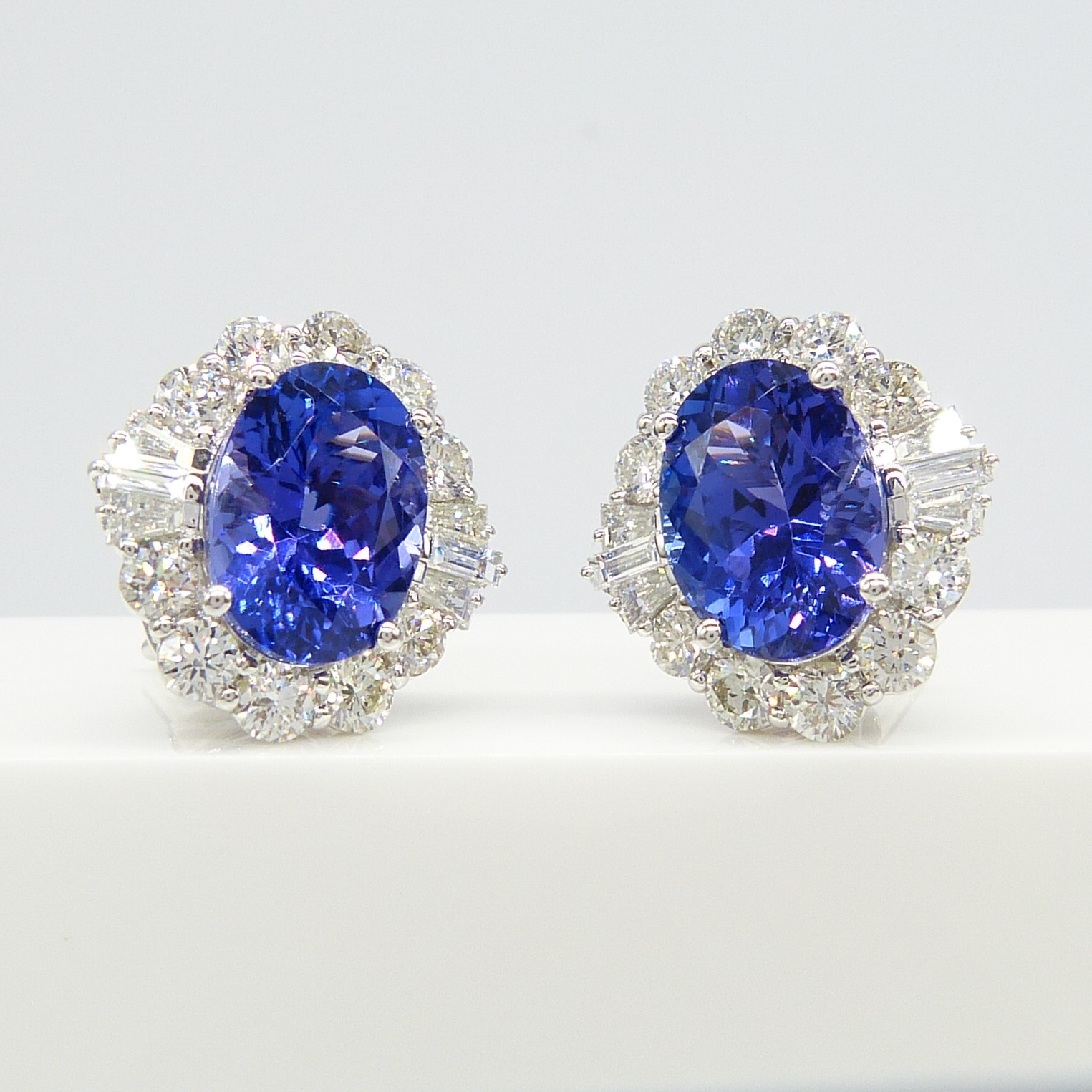 A large pair of loupe-clean tanzanite and diamond cluster earrings in 18ct white gold, certificated