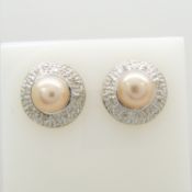 A peach pearl and diamond collar ear studs in 9ct yellow gold, boxed