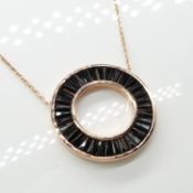 A rose-gold plated silver tapered baguette black cubic zirconia-set necklace