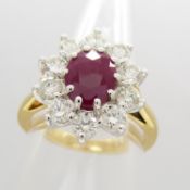 A stylish 18ct yellow gold oval ruby and diamond cluster ring with certificate