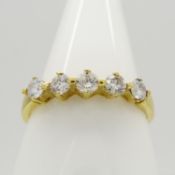 A certificated 18ct yellow gold 0.30 carat G-H colour 5-stone diamond ring