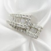 A 1.00 carat baguette and round brilliant-cut diamond ring in white gold, certificated