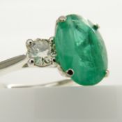 An impressive certificated 2.90 carat emerald and diamond trilogy ring in platinum