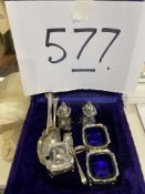 Collection of plated cruets and spoons in a box