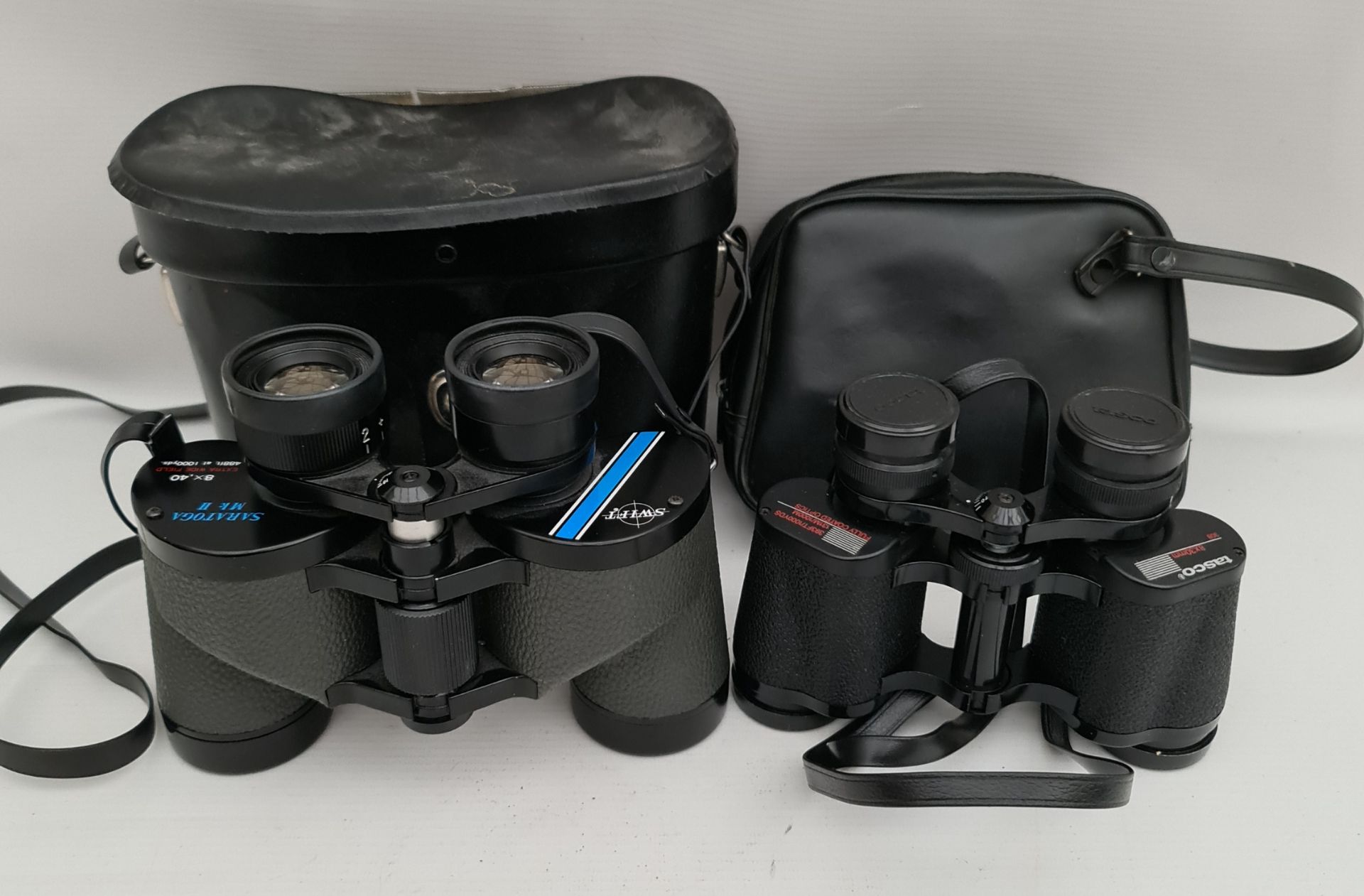 Vintage Binoculars Includes Swift Saratoga Mk II and Tasco. Both with original cases Vintage