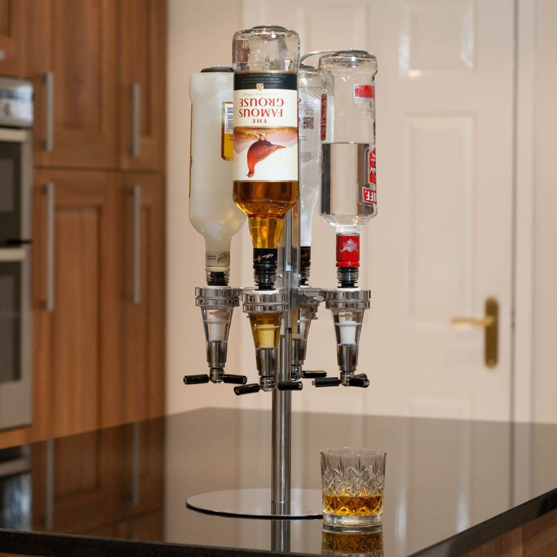 (7M) Lot RRP £120. 4x 4 Bottle Optic Bar Butler Rotary Bottle Stand And Dispenser RRP £30 Each. (A