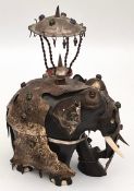 An Antique Indian Ebony Elephant Figure in Metal Armour and Howdah