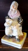Vintage Ceramic Figure Old Lady Pouring A Drink. Measures 6 inches tall.