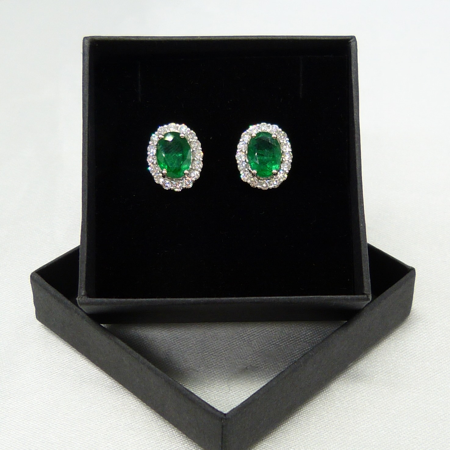 Pair of 18ct white gold 2.48 carat emerald and diamond halo ear studs, boxed - Image 2 of 8