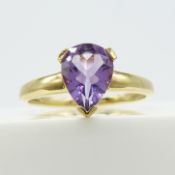 9ct yellow gold ring set with a 0.80 carat pear shape purple amethyst gemstone