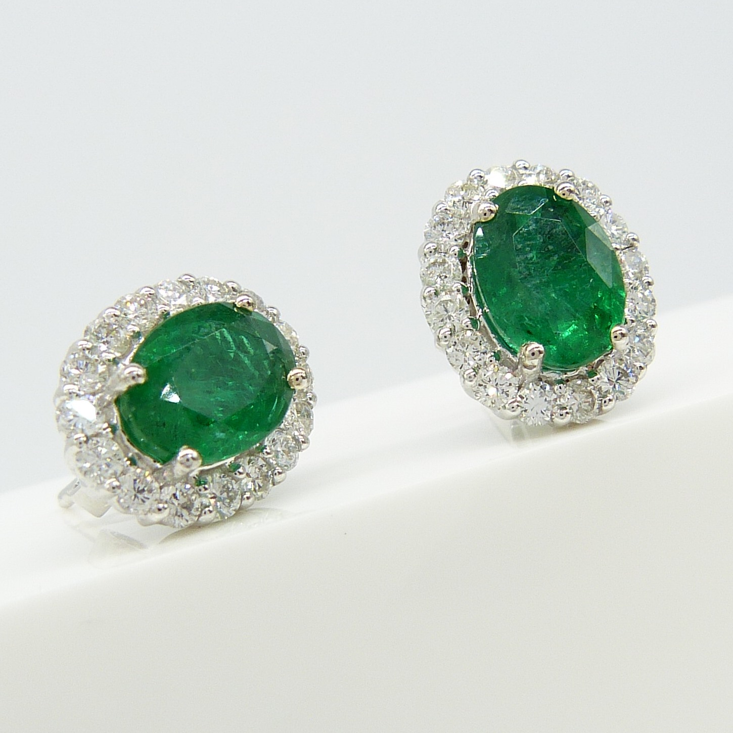 Pair of 18ct white gold 2.48 carat emerald and diamond halo ear studs, boxed - Image 6 of 8