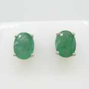 Pair of oval green emerald gemstone stud earrings in silver