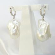 Boxed pair of unusual 18ct white gold baroque pearl earrings with diamond-set bales