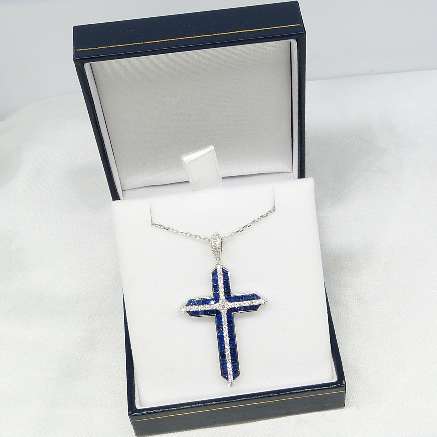 Impressive cross necklace set with natural sapphires and diamonds in 18ct white gold, boxed