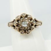 A hand-made period-style diamond daisy cluster ring in rose gold