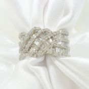 Large wave-style 2.00 carat baguette and round brilliant-cut diamond cluster ring in white gold