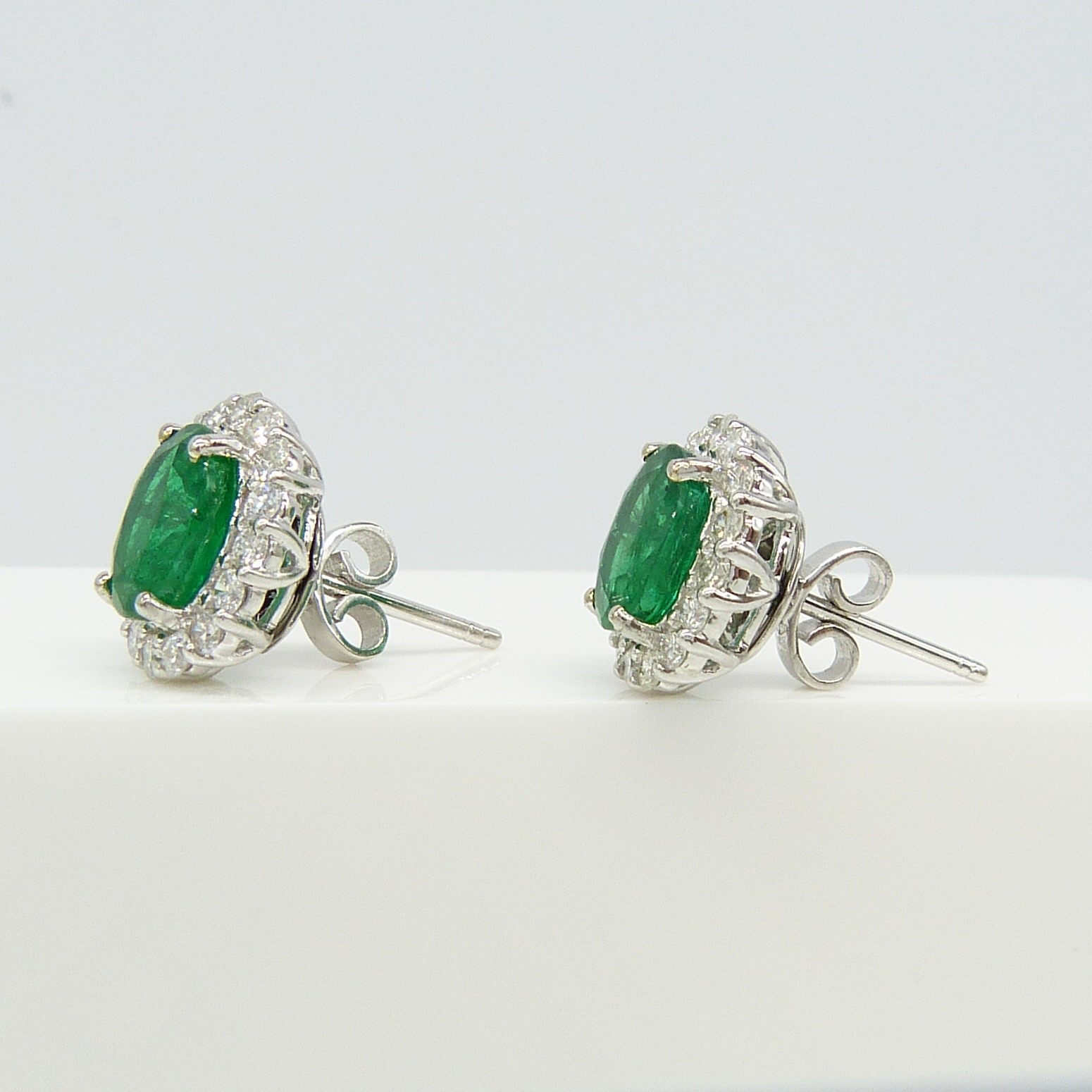 Pair of 18ct white gold 2.48 carat emerald and diamond halo ear studs, boxed - Image 7 of 8