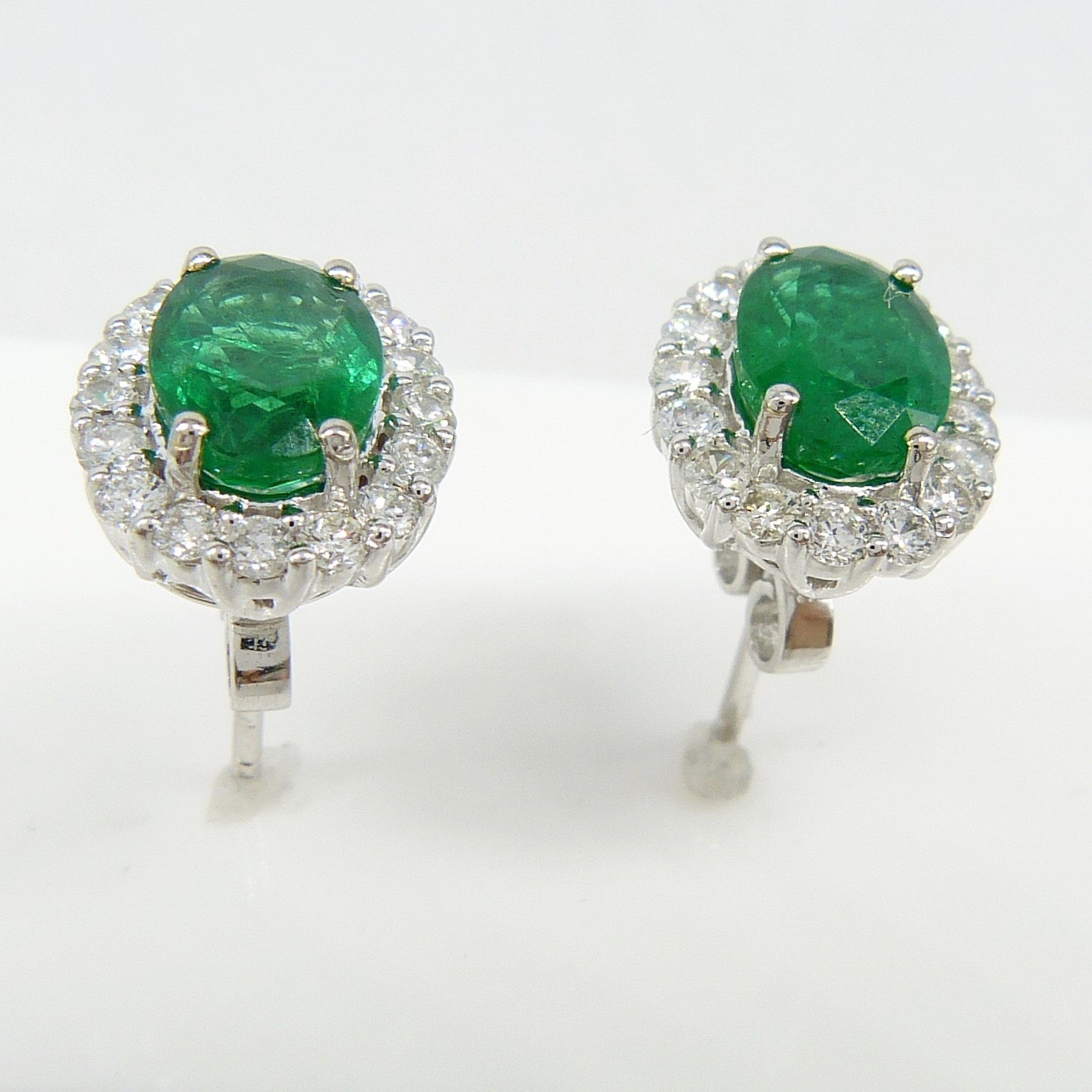 Pair of 18ct white gold 2.48 carat emerald and diamond halo ear studs, boxed - Image 3 of 8