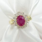 Oval ruby and diamond cluster dress ring