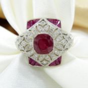 Platinum Victorian-style dress ring set with rubies and diamonds in a pierced, ornate setting