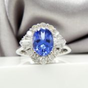 Vibrant tanzanite and diamond cluster ring in 18ct white gold