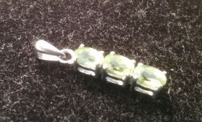 Silver and peridot pendant