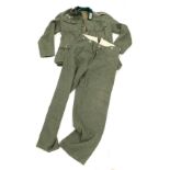 A film prop woolen jacket and trousers, from Band of Brothers, marked Wardrobe Issued and numbere...