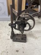 Antique cast iron hand-cranked drill press