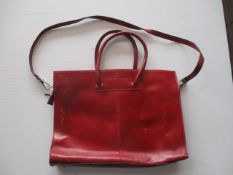 Ladies red leather tote as pictured has some marks , previous use -