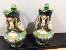 A pair of Majolica Ewers, superbly decorated