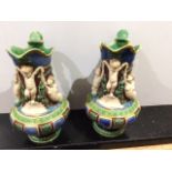 A pair of Majolica Ewers, superbly decorated