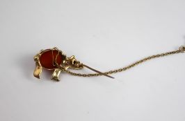 Gold Rhino Form Brooch with Carnelian & Ruby Eyes