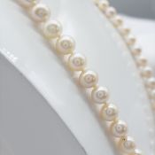 A Classic Cultured Pearl Strung Necklace With Yellow Gold Ball Clasp