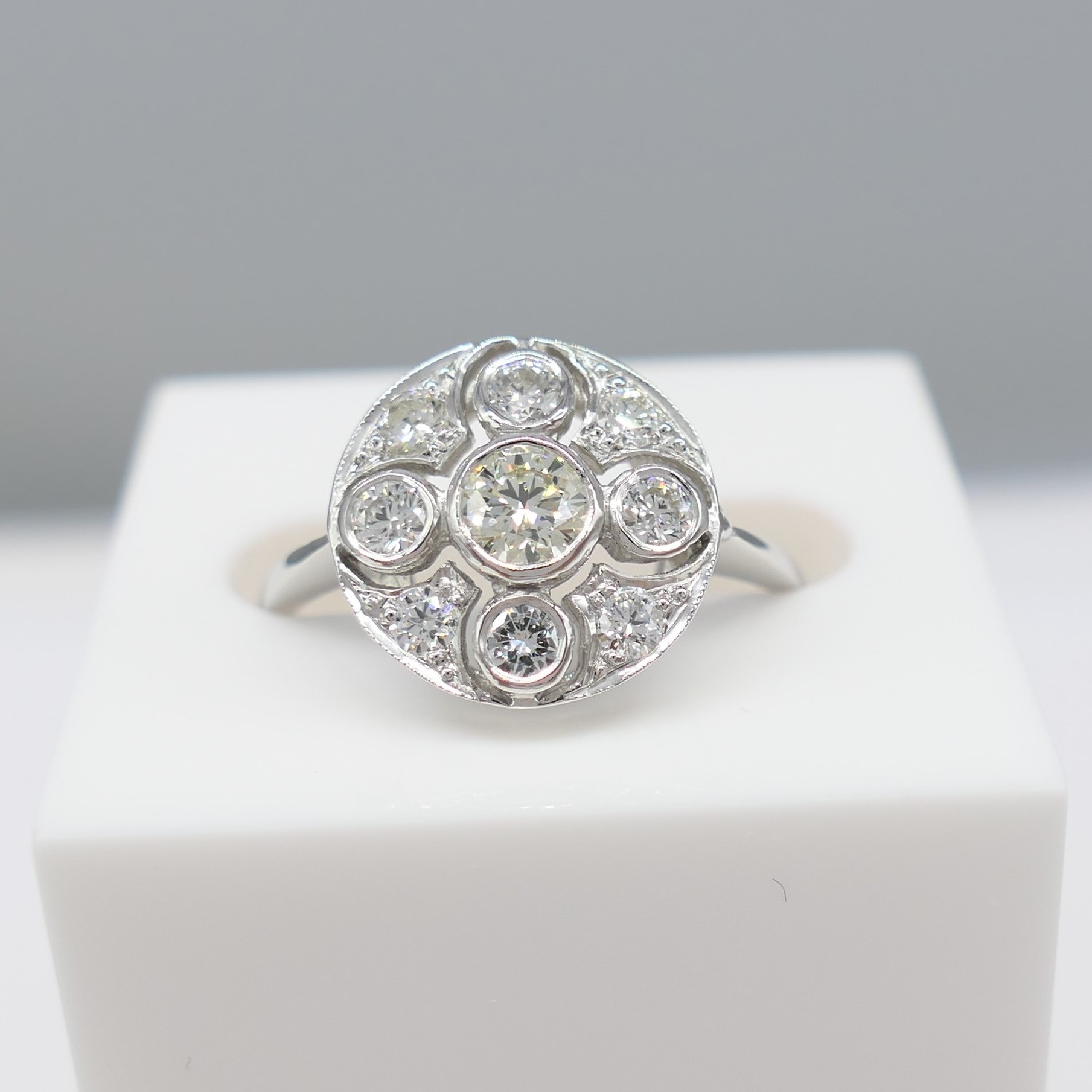 A Vintage-Style Platinum And 0.60Ct Diamond Cluster Ring