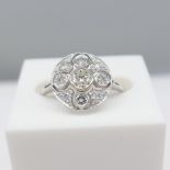 A Vintage-Style Platinum And 0.60Ct Diamond Cluster Ring