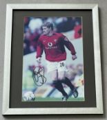 Signed framed image of 'Ole Gunnar Solskjaer' playing for Manchester United Football Club with CO...