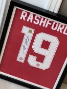 Signed Manchester United football shirt by ‘Marcus Rashford’, framed with COA