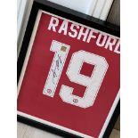 Signed Manchester United football shirt by ‘Marcus Rashford’, framed with COA