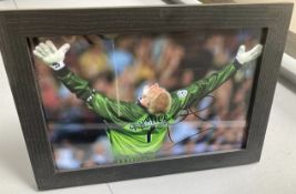 Signed framed image of 'Peter Schmeichel' playing for Manchester United Football Club with COA