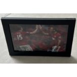 Signed framed image of 'Rio' and 'Vidic' playing for Manchester United Football Club with COA