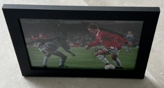 Signed framed image of 'Ole Gunnar Solskjaer' playing for Manchester United Football Club with CO...